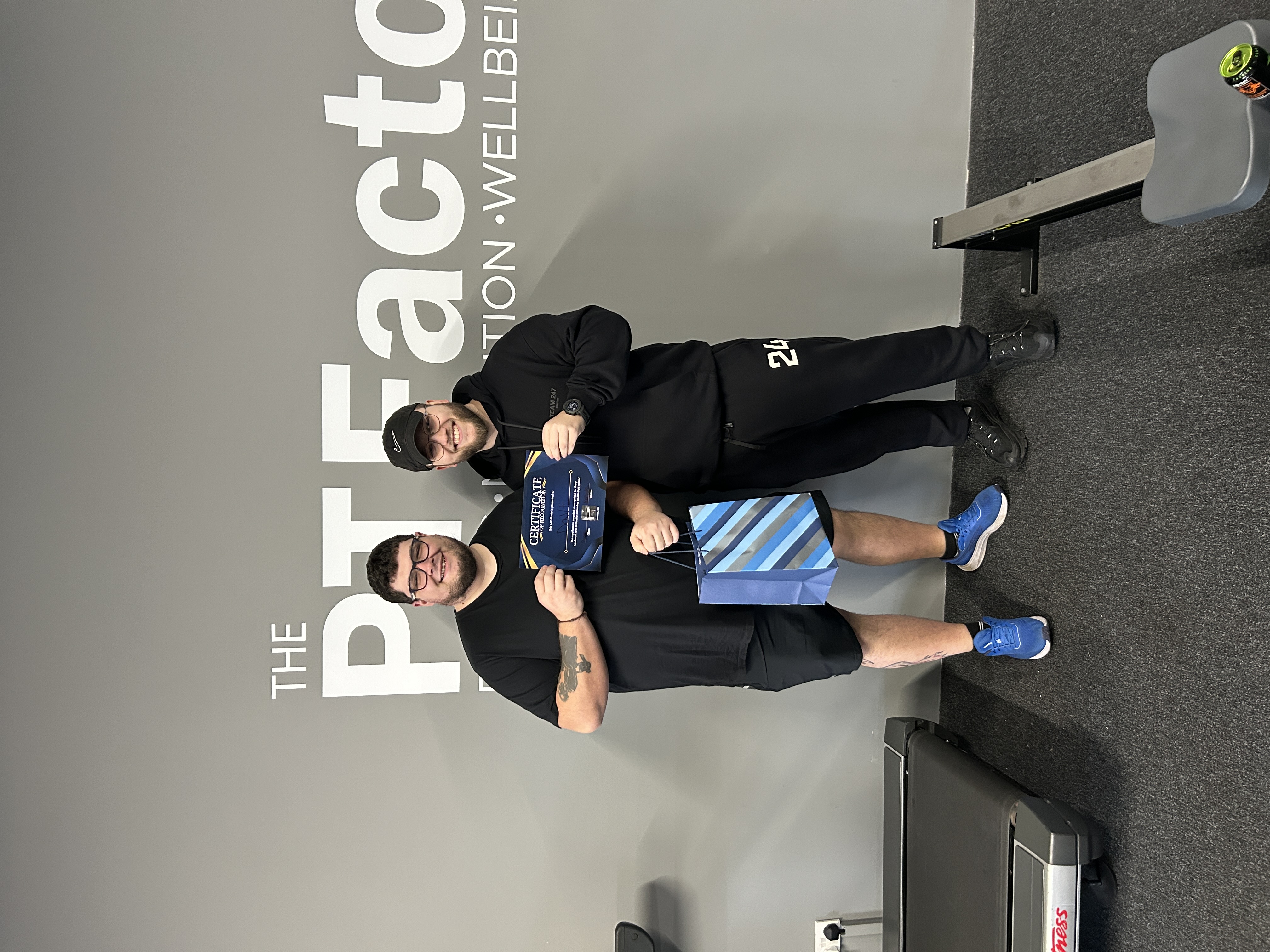 Kallum with Dave celebrating his weight loss achievement at PT Factory